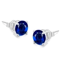 Detail view of blue round cubic zirconia stud earrings with silver four-prong setting - 3mm Royal Blue Stone / Platinum