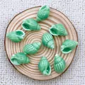 DIY jewelry making supplies with 9 pieces of green shell-shaped ceramic beads for bracelets - Peacock Green