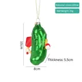 Sparkly green glass pickle Christmas ornament holding a paddle, 10cm holiday decoration - Pickle Player Ornament