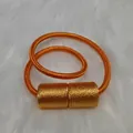 Magnetic curtain tieback with orange braided rope and textured gold cylindrical buckles - Sweet Orange