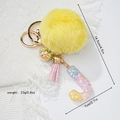 Detail view of yellow pompom and resin letter J keychain with size measurements - Letter J
