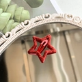 Y2K style red glitter star hair clip with BB snap fastener on a decorative mirror - Bright Red Glitter