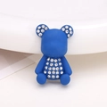 Detail view of a matte blue bear accessory featuring sparkling rhinestone embellishments - Klein Blue Painted Bear