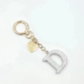 Portachiavi dorato con lettera D in cristallo e ciondolo a cuore inciso I LOVE YOU - Lettera D