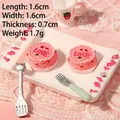 Macro view of miniature pink resin heart cake with LOVE text and tiny tray set - Pink LOVE Cake