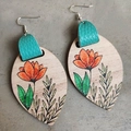 Detail of bohemian wood earrings with sunflower patterns and teal leather accents - Orange Flower with Teal Leather (5)