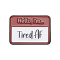 Rectangle enamel pin featuring 'Hello, I'm... Tired AF' in red and white colors - Tired Name Tag