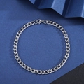 Polished silver stainless steel Cuban link bracelet with lobster clasp on geometric background - Side Curb Bracelet [Width 5mm] / Length 21cm