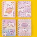 Mini A7 spiral notebooks featuring cute unicorn designs in pink, purple, and blue colors - Unicorn