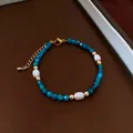 Detailed macro view of natural blue stones and baroque pearls on adjustable necklace - 30# Bracelet-Gold-Blue-White-Gift Box