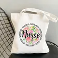White canvas tote bag featuring nurse floral print with supportive powerful caring text - Style C2 (No Inner Pocket/No Zipper)