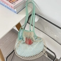 Detail of minimalist woven mesh tote bag with light green canvas handle and blue inner pouch - Grey Green