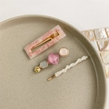 Detailed set of three elegant pearl and floral acrylic hair clips on ceramic tray - Style 11 (3-Piece Set/Pink Floral Texture)