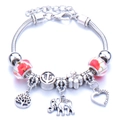 Silver charm bracelet with tree of life, elephant and red floral patterned beads - Red & White