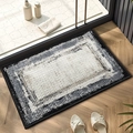 Thick grey and white gradient chenille bath mat placed on a wooden floor in a bathroom - Mottled Rectangle