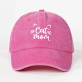 Close-up of pink cotton baseball cap with white Cat Mom embroidery and cat whiskers - Rose Red