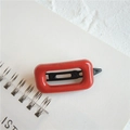 Minimalist red rectangular hair clip with black metal hinge on white notebook - Square Orange