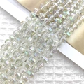 Macro shot of 8mm faceted aurora glass beads showing prismatic light for DIY jewelry - Light Green AB