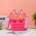 Detailed macro of unicorn silicone pop-it shoulder bag with adjustable printed strap - Rose Red