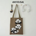 Close-up of brown knitted tote bag featuring three pandas eating bamboo patterns - Three Bears Brown