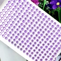 Macro shot of 3mm purple round acrylic rhinestone sticker sheet for DIY crafts - 6mm / Purple