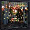Removable static Christmas window stickers featuring Santa Claus and reindeer on glass - Four-in-One Christmas Cartoon Characters Style (SR-23)