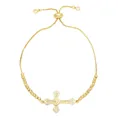 Bracciale regolabile in oro con croce e cuore decorato con zirconi su sfondo bianco - Cuore e Croce