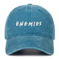Close-up of blue washed denim baseball cap with white ENEMIES embroidered text - Lake Blue