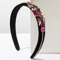 Macro detail of velvet headband with colorful geometric crystals and rhinestone lines - Colorful