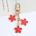 DIY metal keychain featuring red enamel flower pendants with gold hardware and D-ring - Watermelon red