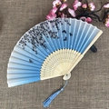 Blue silk folding fan with bamboo frame featuring black floral and butterfly patterns - No.46 Blue Gradient Floral Butterfly