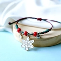 Handmade Christmas friendship bracelet with red and green cord and snowflake charm - Snowflake