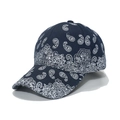 Detailed side view of navy blue baseball cap featuring white paisley print and curved brim - 56-60cm Adjustable / Navy Blue
