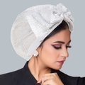 Silver turban hat for women featuring a large bow and shiny metallic silk finish - White