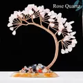 Pink crystal money tree with copper wire branches on a natural stone base - Rose Quartz Phoenix Tail Tree