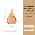 Pear-shaped beech wood coaster with hanging loop, dimensions 16.4x10.5x1.5cm and 96g weight - Pear Shape Beech Wood Coaster