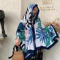 Tropical leaf print scarf in white and blue, shown as a stylish headscarf or shawl - Pink And Blue Leaves