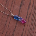 Detailed shot of a blue and pink gradient crystal pendant wrapped in silver wire on wood - A-NSN0236 Platinum Copper O-Chain