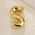 Detailed close-up of a 3D bubble style golden letter S pendant with a mirror polish finish - S