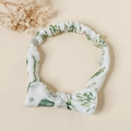 Detail of floral baby headband with a cotton bow design and elastic stretchy band - Green Plants and Flowers