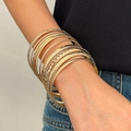 Detail of stacked gold alloy bracelets with smooth, matte, and braided textures - 06 KC Gold 9179 (10-Piece Set)