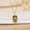 Elegant 18K gold plated owl necklace featuring hollow design and sparkling blue gemstones - Gold Hollow Owl/Blue Black Eye