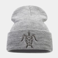 Close-up of a grey beanie featuring detailed turtle embroidery and a thick knit texture - Light Gray