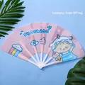 Portable pink cartoon folding fan for women featuring sunshine and rainbow illustrations - Sunshine Girl