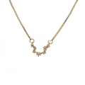 Detailed close-up of golden box chain with sparkling cubic zirconia zodiac constellation pendant - E-Cancer