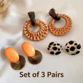 Detailed close-up of a 3-piece vintage earring set with resin and rattan materials - 3-Piece Set (Rattan Hoop + Wood Oval + Leopard Cover)