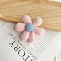 Pink knitted flower gift bag with blue center on a wooden tray for wedding favors - Flower Shape Brooch