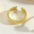 Detailed close-up of 14K gold plated leaf texture ring on beige fabric background - Leaf Texture Style