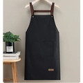 Waterproof black kitchen apron with neck strap and large front pocket in minimalist style - Leather Label Black