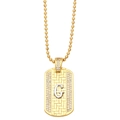 Macro detail of gold rectangle pendant necklace with crystal inlaid letter G and bead chain - Letter G